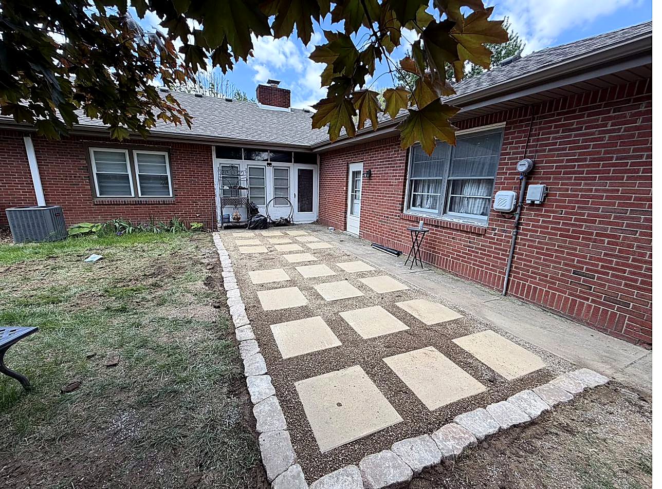 Freshly mulched and edged front beds with decorative curbing